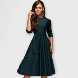 Elegantes dunkelgrünes Swing-Kleid